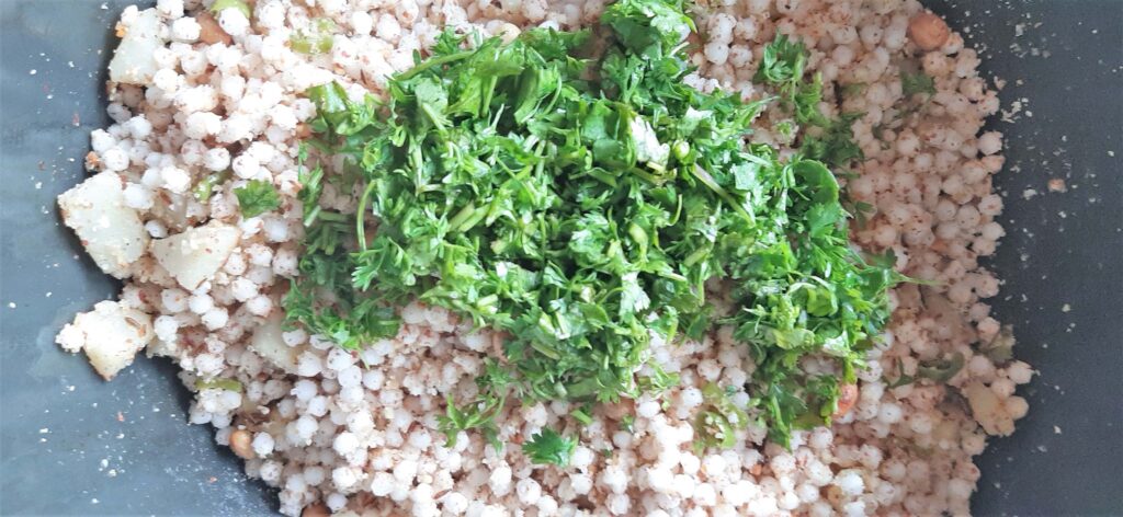 Finely chopped coriander on cooked sabudana or topica pearl.