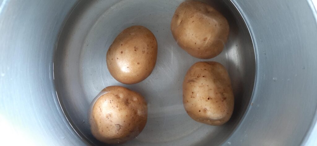 boiling potatoes in a cooker