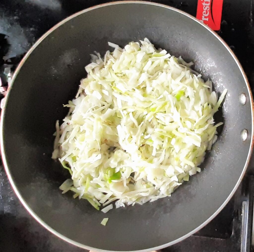 cabbage added in a pan