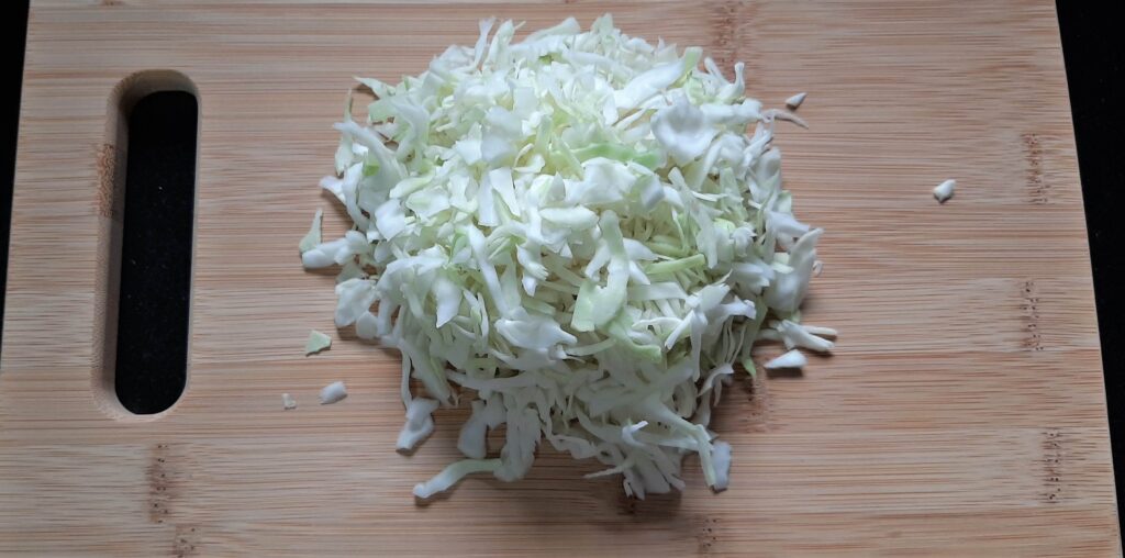 Chopped cabbage on chopping board