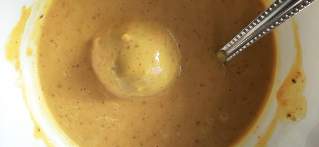 coating potato ball with batata vada mixture