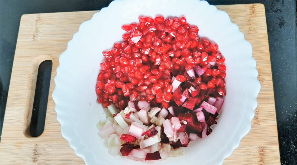 Adding pomegranate to salad