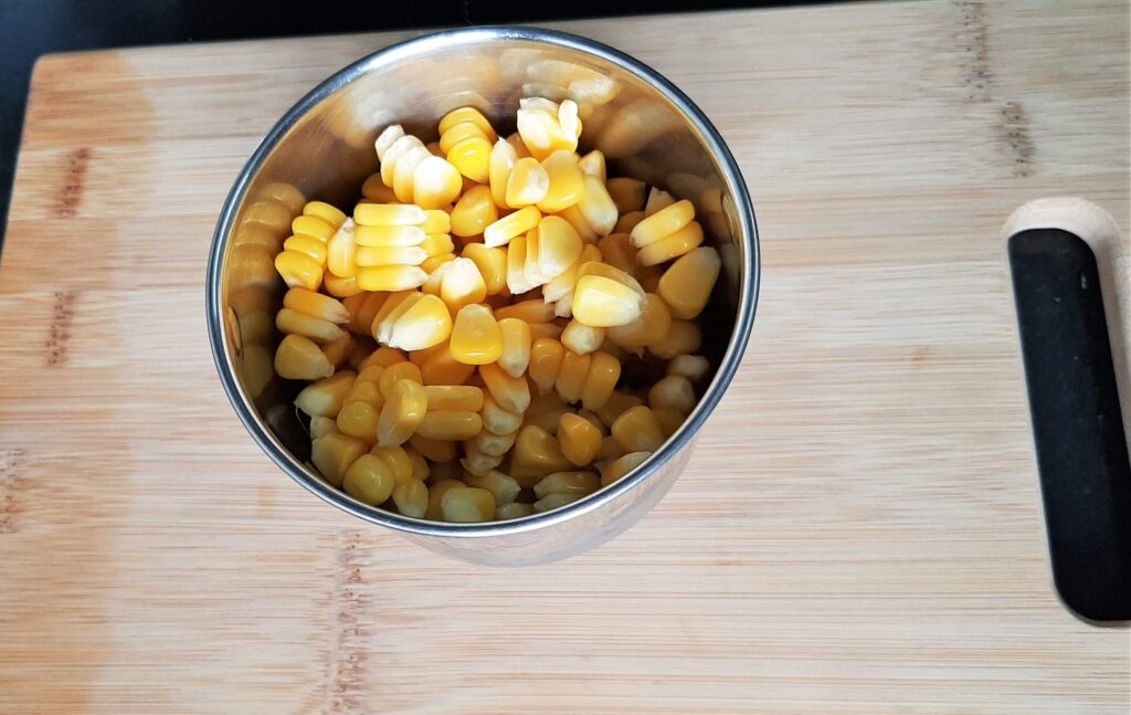 Corn kernels in a grinder