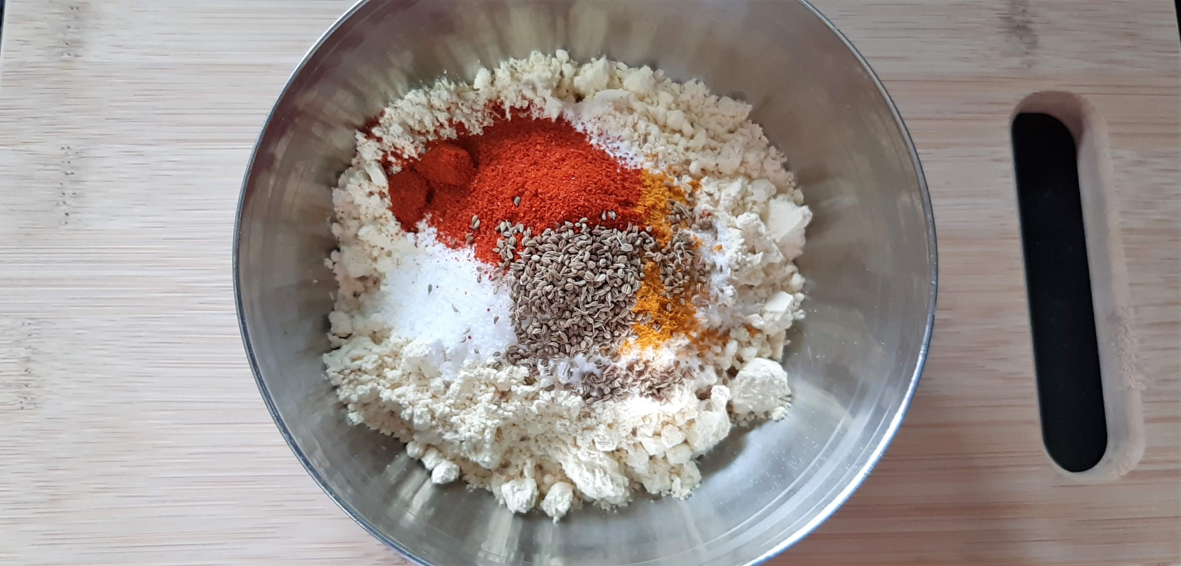 Adding species in aloo pakoda mixture