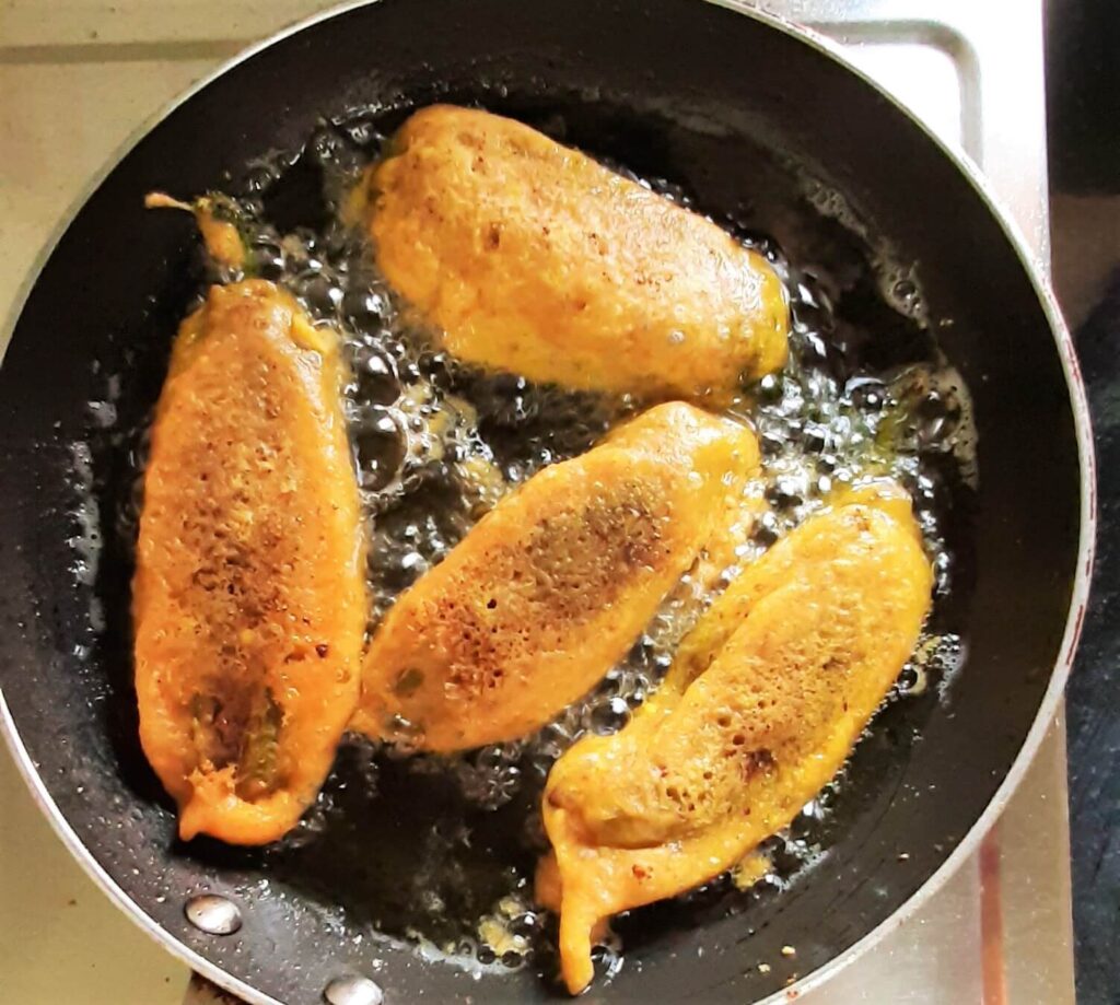 frying stuffed chili pakoda