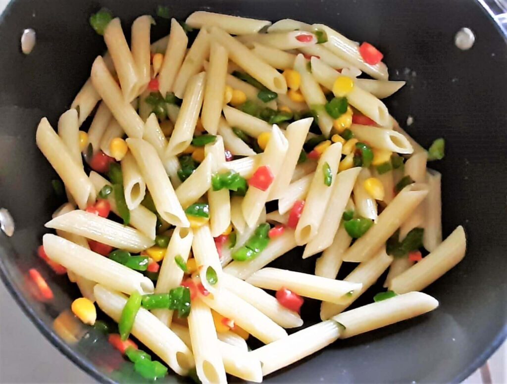 Adding pasta in veggies