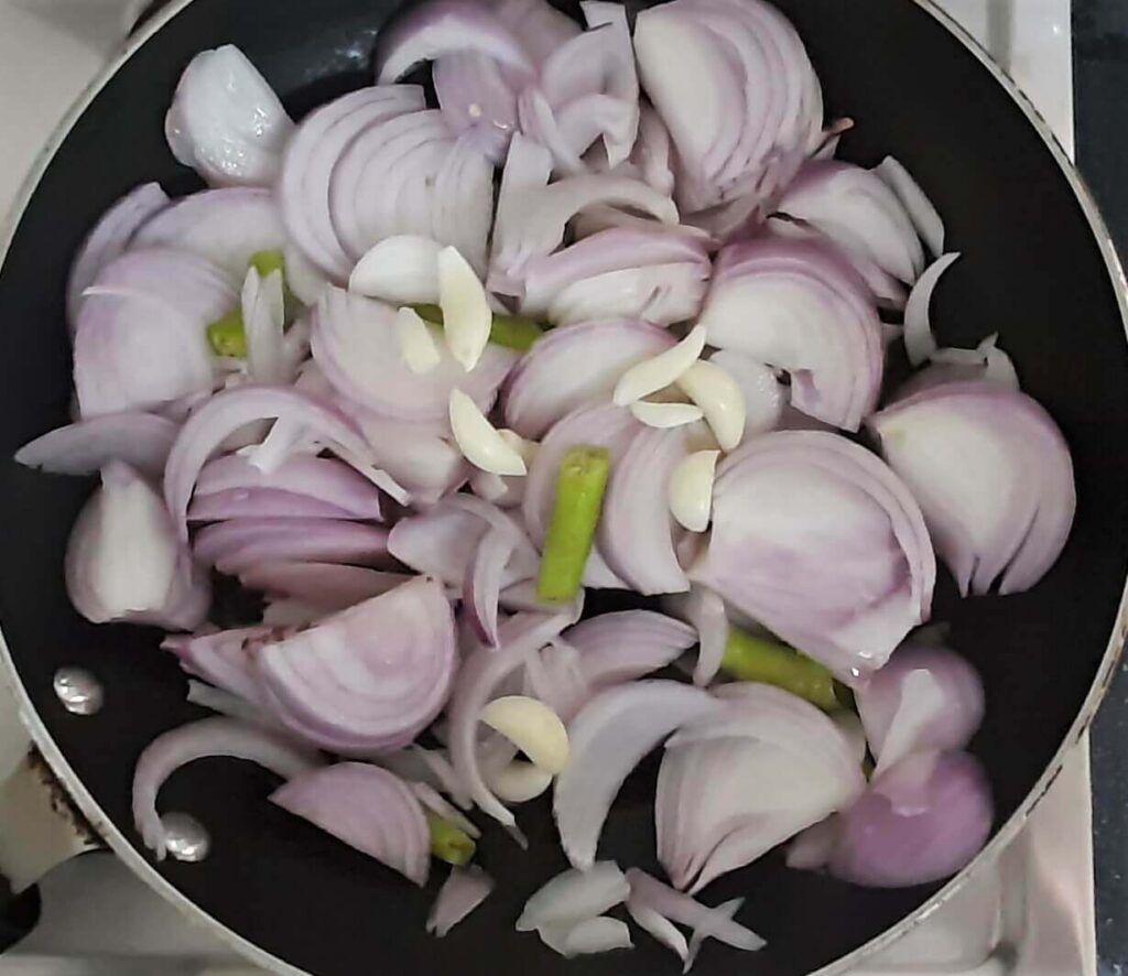 Roasting onions for prawns malai curry
