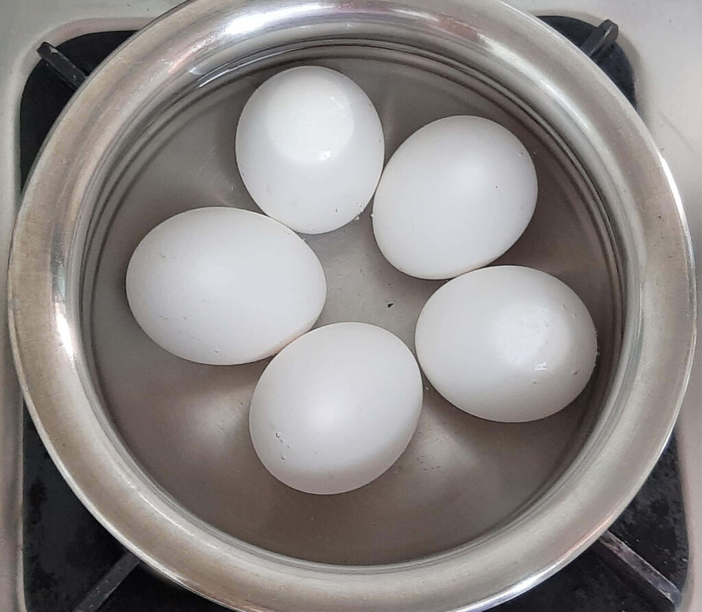 Boiling eggs for egg masala
