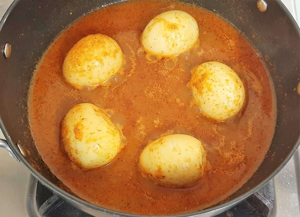 adding water to egg curry