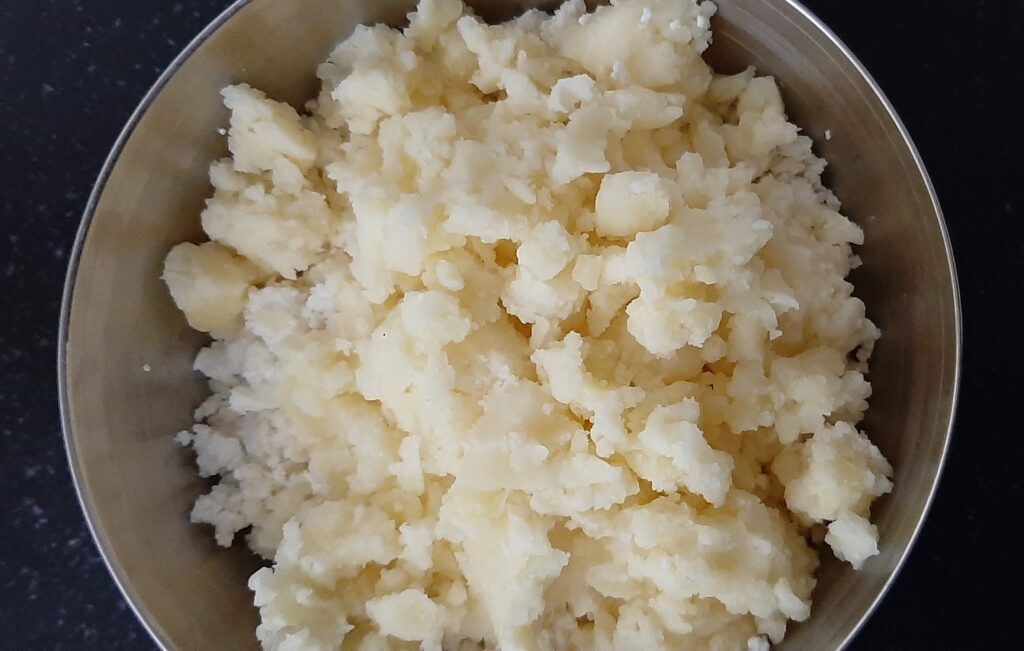 adding mashed potato