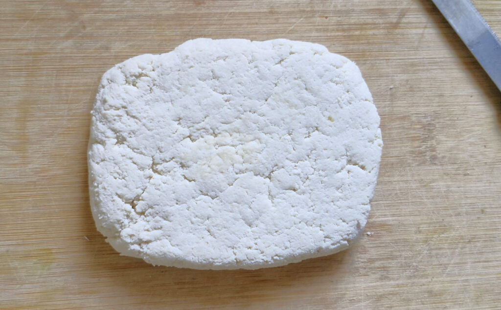 paneer on chopping board